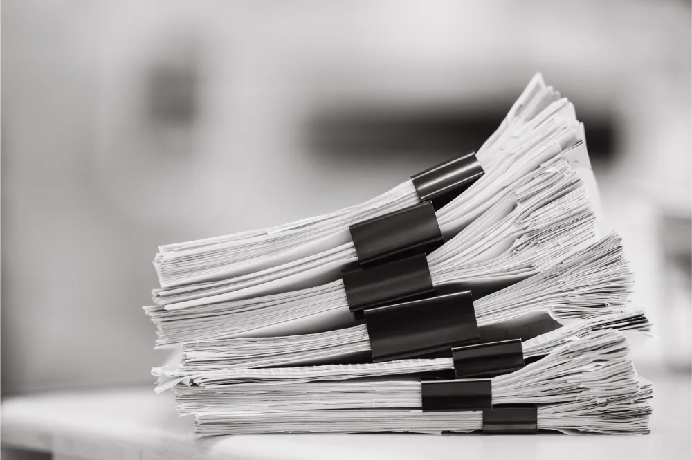 big stack papers documents reuse paperwork office RFP sections