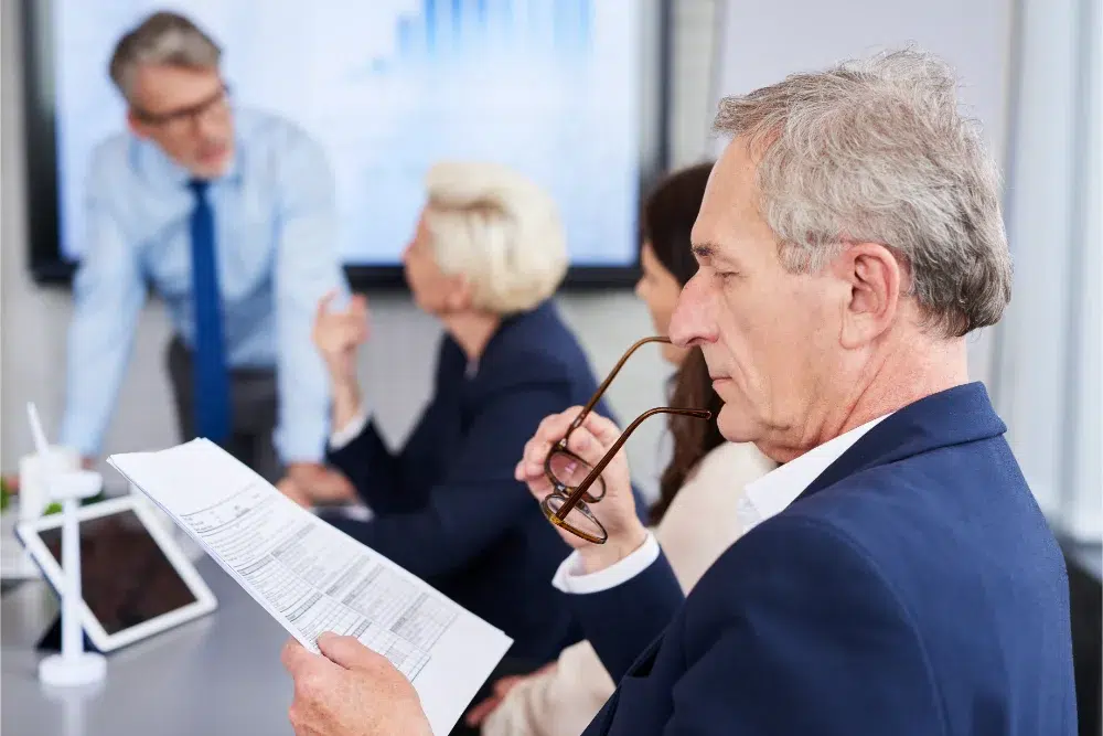 professional reading through technical volume in a federal proposal
