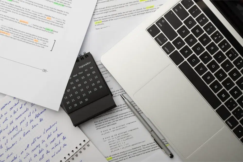 image concept rfp sections scattered paperwork, laptop, and calendar representing time running on bid